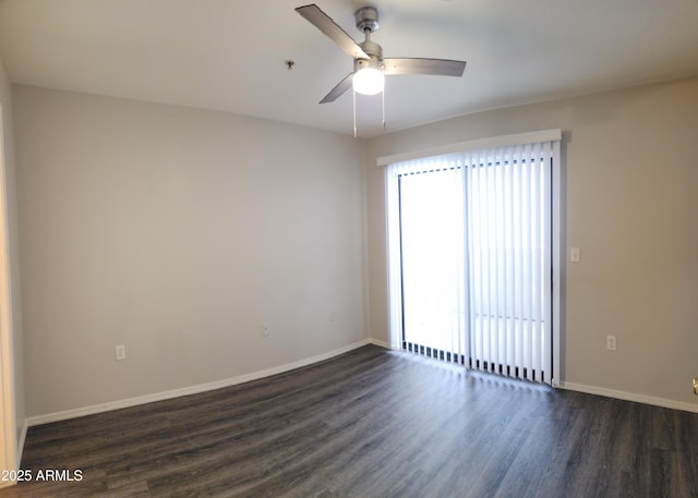 empty room with ceiling fan and dark wood-type flooring