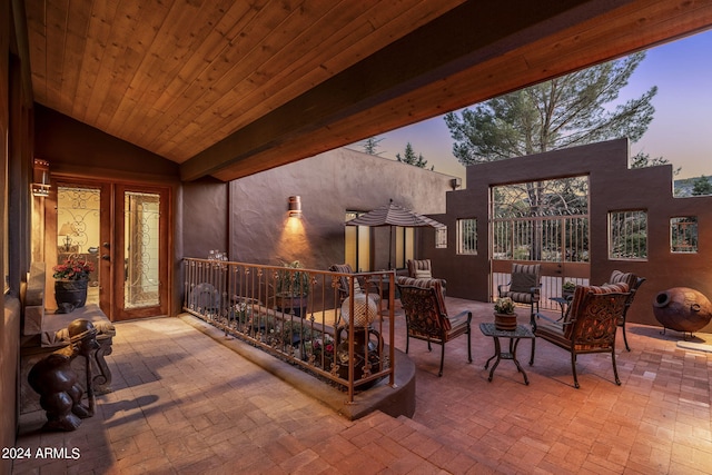 view of patio terrace at dusk