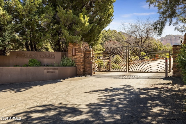 view of gate with fence