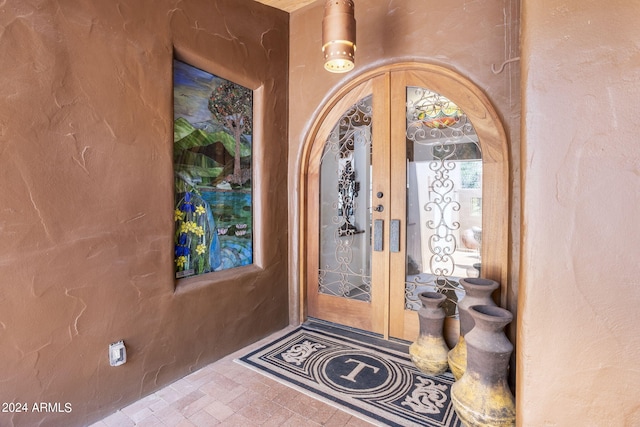 property entrance featuring french doors