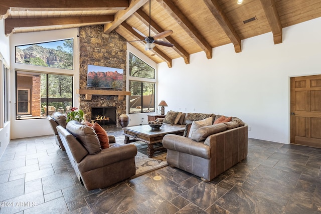 living room featuring wood ceiling, high vaulted ceiling, and stone tile flooring