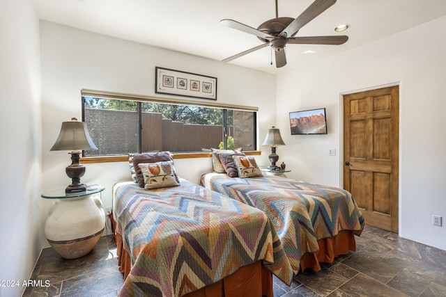 bedroom featuring stone finish flooring, ceiling fan, and recessed lighting