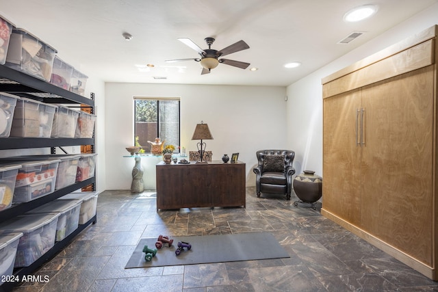 office space with ceiling fan, stone finish flooring, visible vents, and recessed lighting