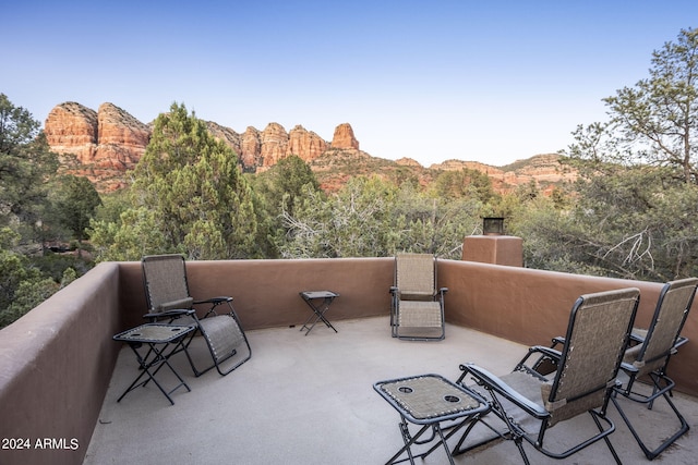 view of patio / terrace featuring a balcony and a mountain view