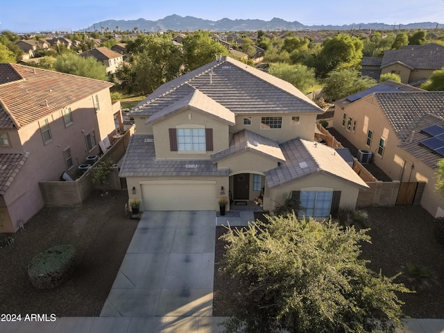 birds eye view of property featuring a mountain view