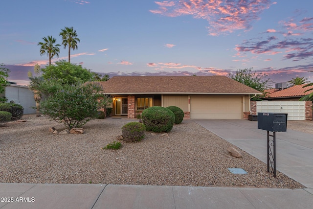 15849 N 46th Pl, Phoenix, AZ 85032 - view of front of property with driveway, a garage, and brick siding