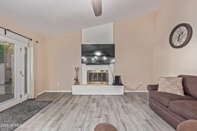 15849 N 46th Pl, Phoenix, AZ 85032 - living area with wood finished floors, baseboards, a glass covered fireplace, and ceiling fan