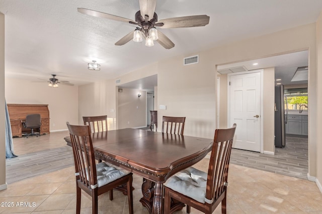 15849 N 46th Pl, Phoenix, AZ 85032 - dining area featuring a ceiling fan, a desk, baseboards, and light tile patterned floors