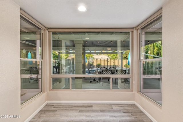 15849 N 46th Pl, Phoenix, AZ 85032 - unfurnished sunroom featuring wood finished floors and baseboards