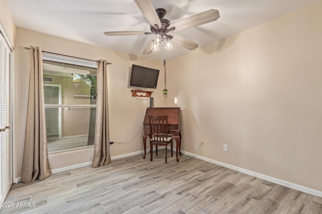 15849 N 46th Pl, Phoenix, AZ 85032 - living area featuring light wood-style flooring, a ceiling fan, and baseboards
