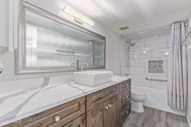 15849 N 46th Pl, Phoenix, AZ 85032 - bathroom featuring toilet, wood finished floors, vanity, and shower / bath combination with curtain