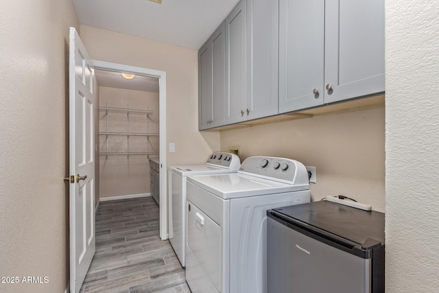 15849 N 46th Pl, Phoenix, AZ 85032 - clothes washing area featuring cabinet space, separate washer and dryer, and light wood-style floors