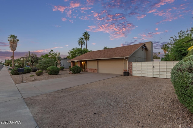 15849 N 46th Pl, Phoenix, AZ 85032 - ranch-style house featuring a garage, concrete driveway, and brick siding