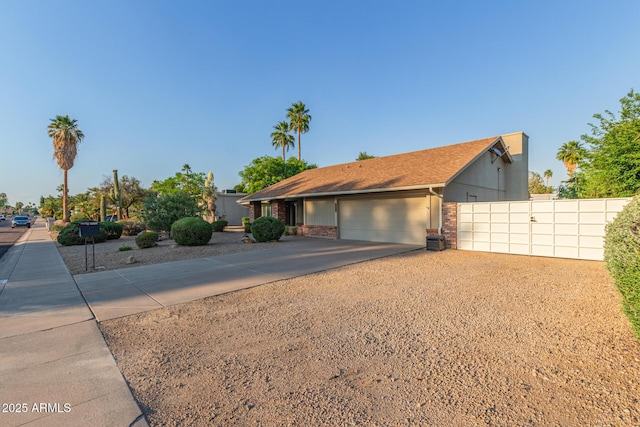 15849 N 46th Pl, Phoenix, AZ 85032 - single story home with an attached garage, concrete driveway, brick siding, and fence