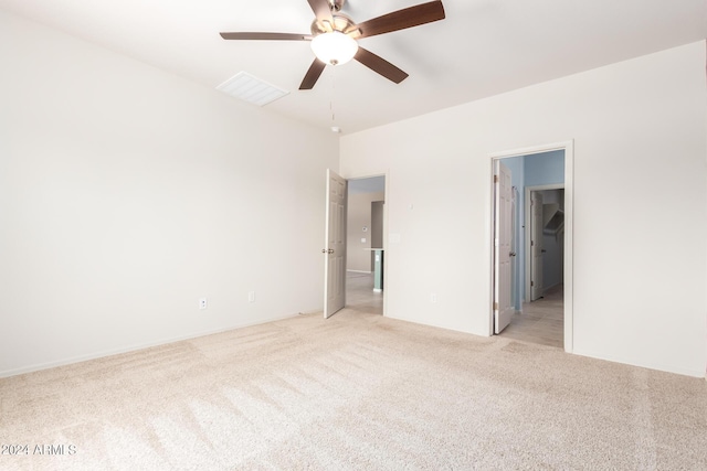 unfurnished bedroom with light colored carpet and ceiling fan