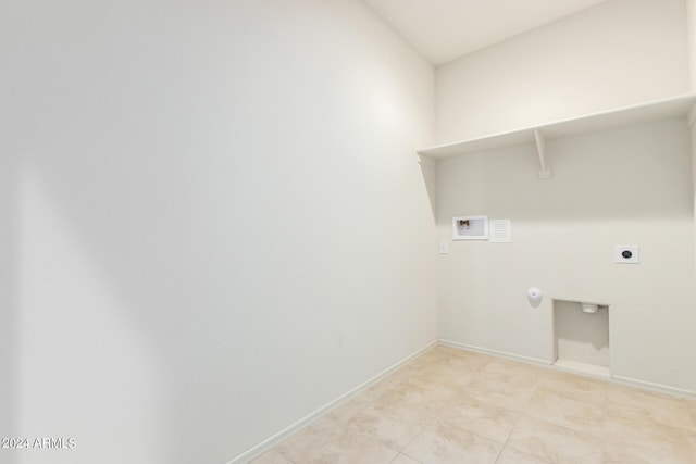 clothes washing area with hookup for a washing machine, hookup for an electric dryer, light tile patterned floors, and hookup for a gas dryer