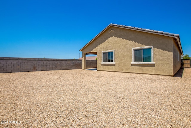 back of house with a patio area