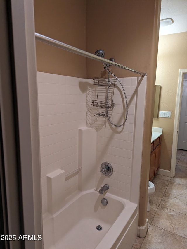 bathroom with toilet, bathtub / shower combination, baseboards, and vanity