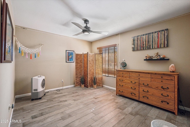 bedroom featuring light hardwood / wood-style floors and ceiling fan