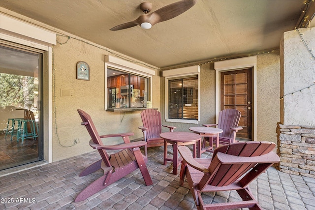 view of patio with ceiling fan