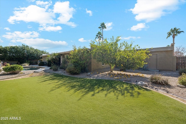 view of yard featuring a fenced in pool