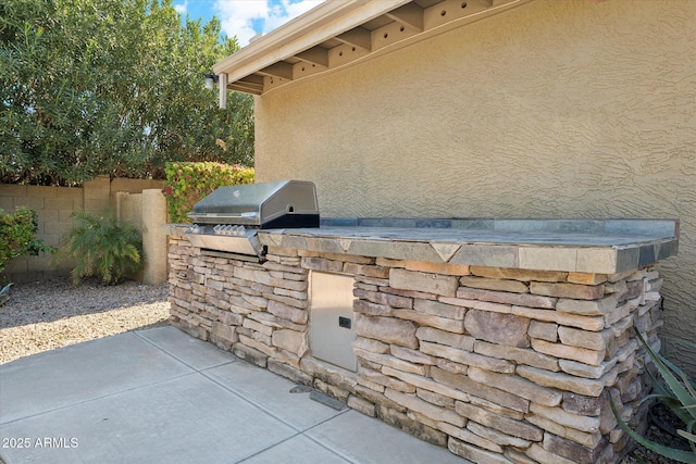 view of patio featuring grilling area and an outdoor kitchen