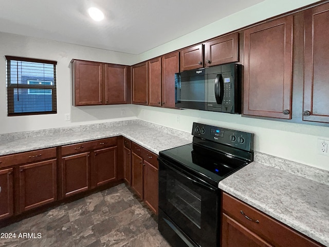 kitchen with black appliances and dark brown cabinets