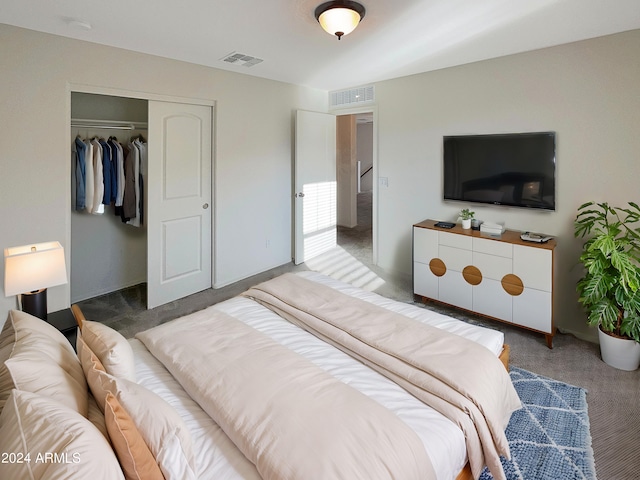 bedroom featuring a closet and dark carpet