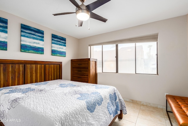 bedroom featuring ceiling fan and light tile patterned floors