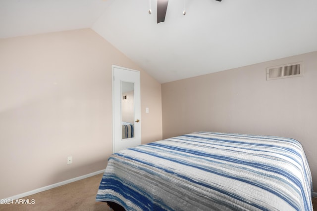 carpeted bedroom with ceiling fan and lofted ceiling