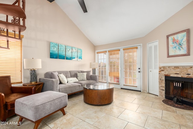 tiled living room with high vaulted ceiling, beamed ceiling, and a stone fireplace