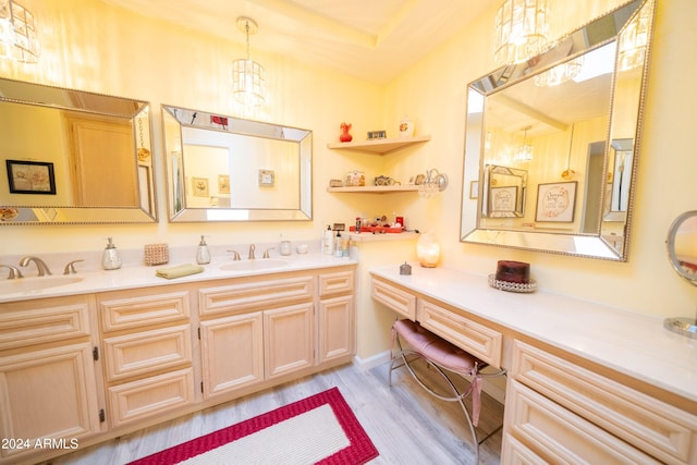 bathroom with vanity and wood-type flooring