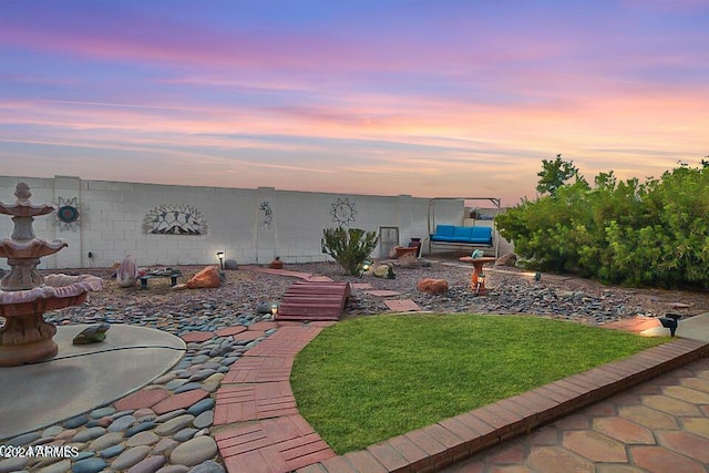 yard at dusk with an outdoor hangout area