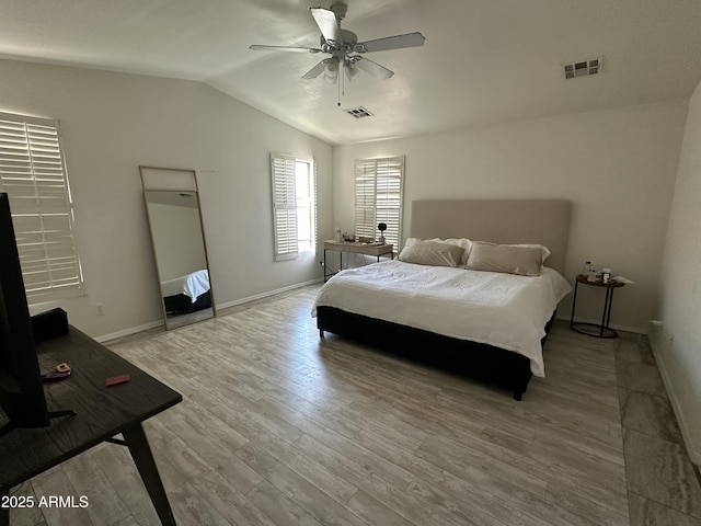 bedroom featuring vaulted ceiling, light hardwood / wood-style flooring, and ceiling fan