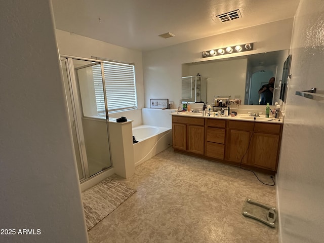 bathroom with shower with separate bathtub and vanity