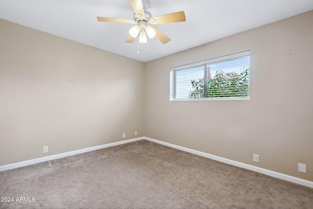 unfurnished room featuring carpet floors and ceiling fan