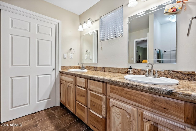 bathroom with vanity and tile patterned flooring