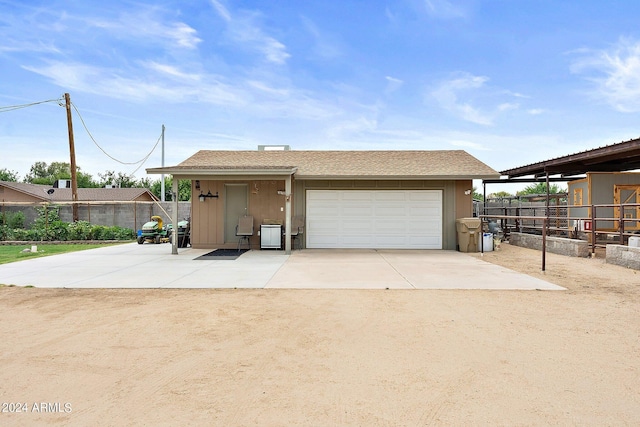 view of front of property featuring an outdoor structure