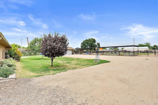 exterior space with a garage and a lawn