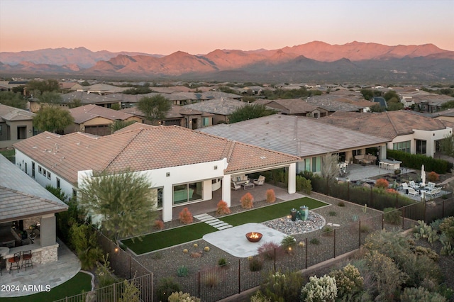 aerial view at dusk with a mountain view