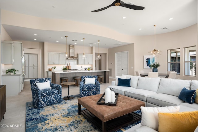 living room with ceiling fan and sink