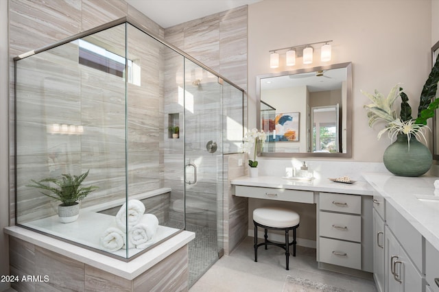 bathroom with tile patterned flooring, a shower with shower door, and vanity