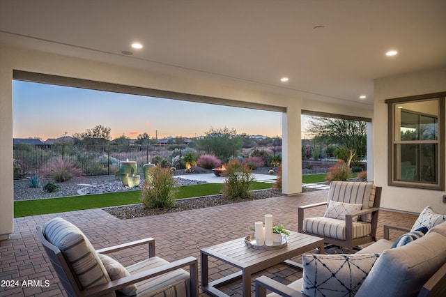 view of patio terrace at dusk