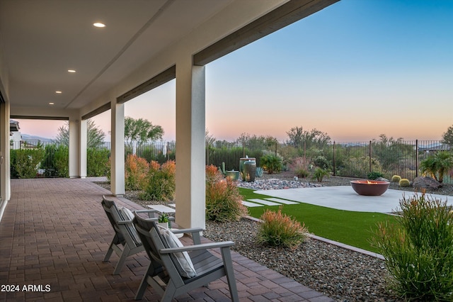 view of patio terrace at dusk