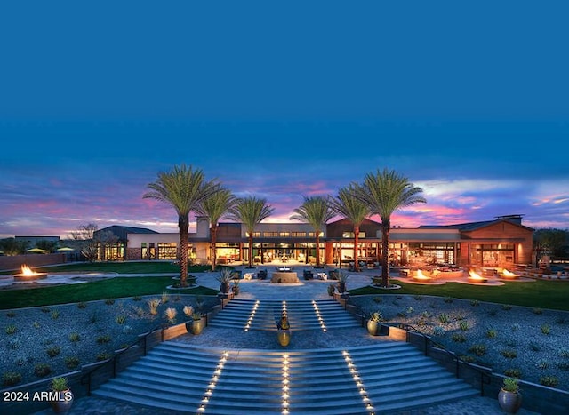 pool at dusk with a lawn