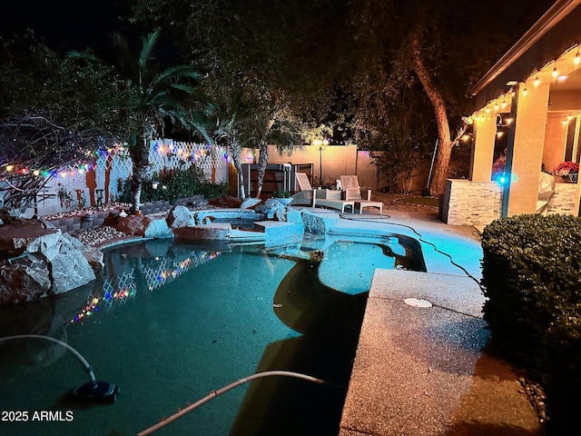 view of pool featuring a patio, a fenced backyard, a fenced in pool, and an in ground hot tub