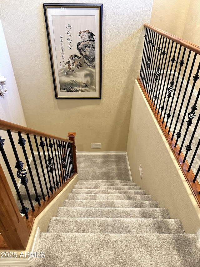 staircase with baseboards