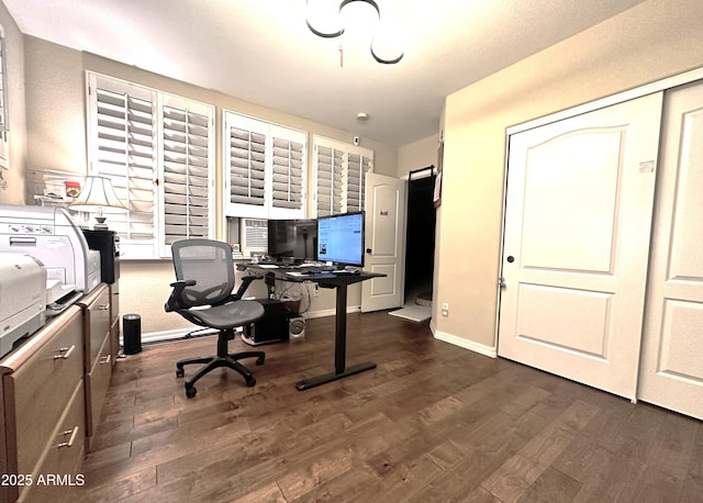 office area featuring baseboards and dark wood-style flooring