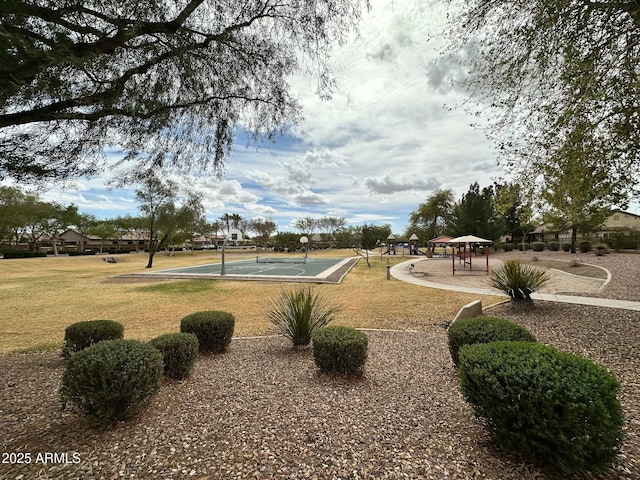 view of community featuring a gazebo, community basketball court, and a yard