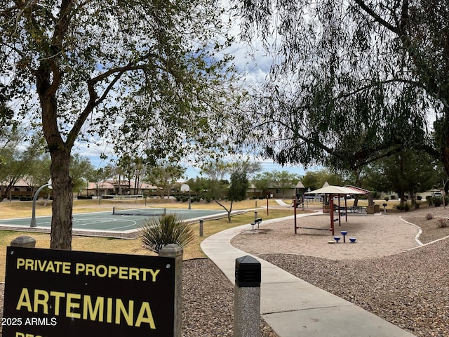 surrounding community featuring community basketball court